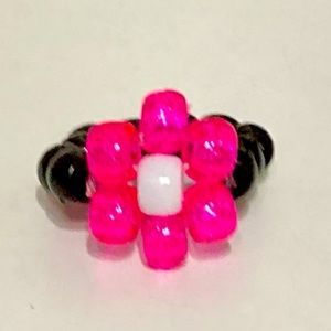 Pink flower ring and green flower ring.